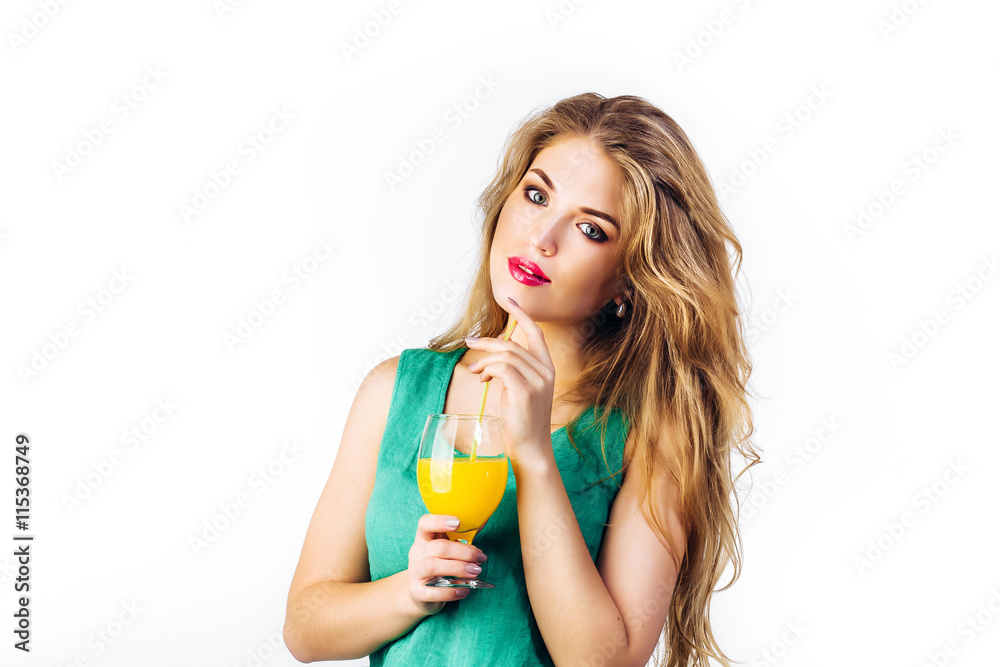Pretty young woman with orange juice. Girl in dress on white background Pretty young woman with orange juice. Girl in dress on white background