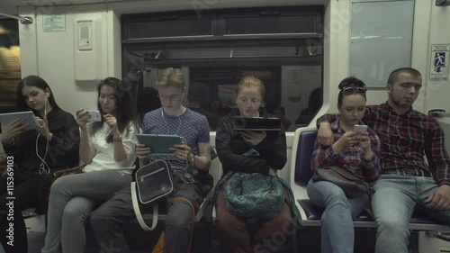 People Are Using Tablets While Riding A Metro