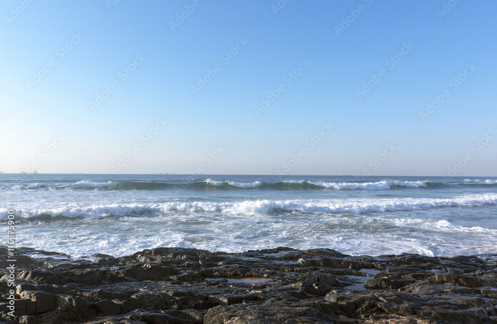 Dark Rocks  Ocean Waves and Blue Skyline Seascape