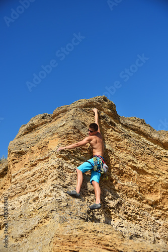 man climbing on Mountain