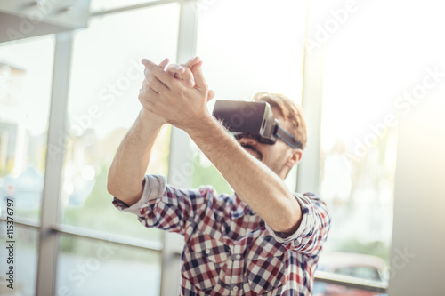 Young man with virtual reality goggles
