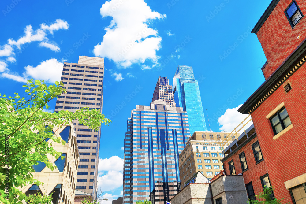 Fototapeta premium Bottom up view to skyscrapers mirrored in glass in Philadelphia