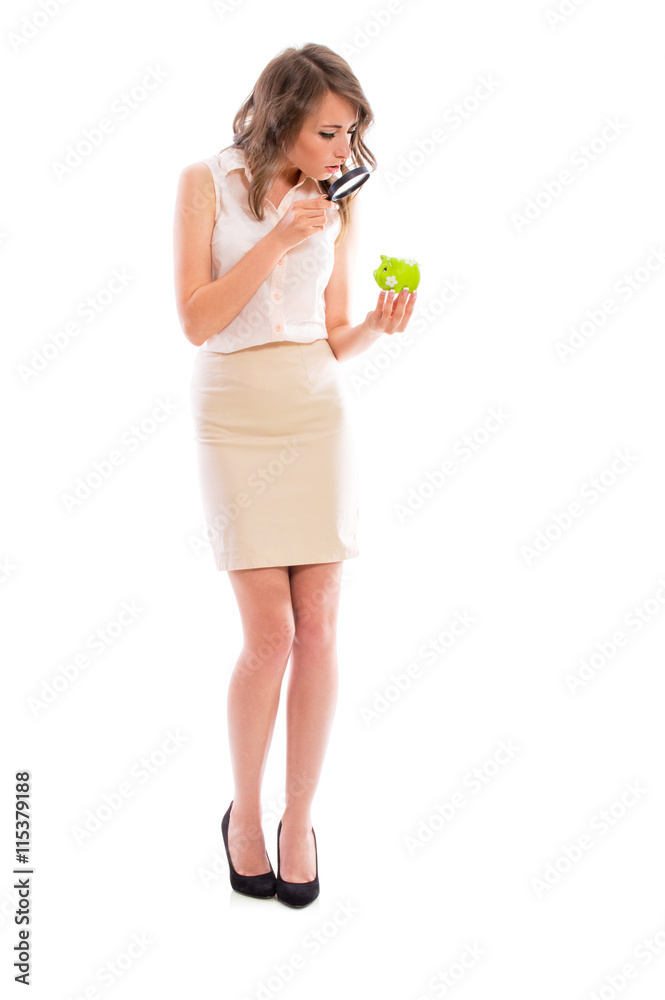 Young attractive brunette woman in a business suit with a piggy bank pig posing in studio isolated on white background. Young attractive brunette woman in a business suit with a piggy bank pig posing in studio isolated on white background.