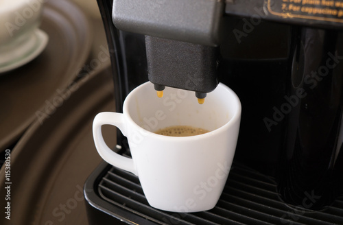 coffee machine makes a hot coffee with icecream