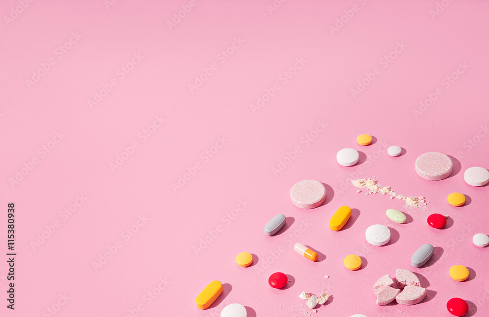 concept theme.bright pills on pink background
