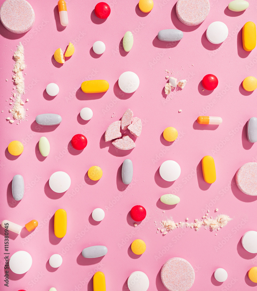 concept theme.bright pills on pink background