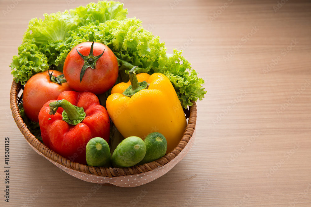 Fresh vegetable prepared in bowl on wooden table, Lettuce cucumb Fresh vegetable prepared in bowl on wooden table, Lettuce cucumb