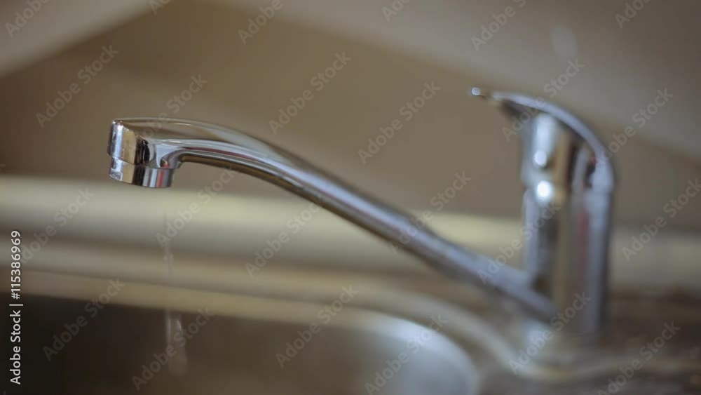Metal tap with water drops. Economy And Saving Concept Metal tap with water drops. Economy And Saving Concept