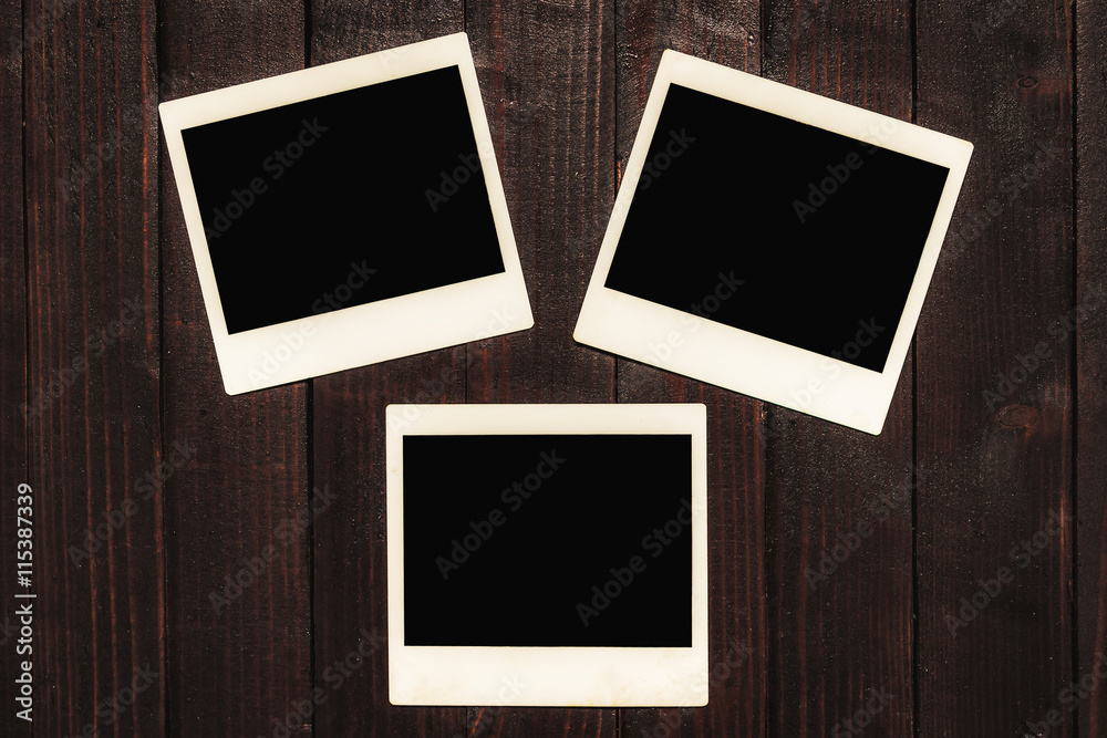Blank Polaroid Photos on Wooden Background Blank Polaroid Photos on Wooden Background