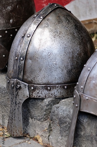 Conical Norman casque helmet placed on cur stone during medieval festival