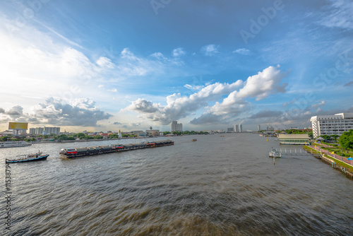 Tugboat towing freighter in Chao Praya River - Bangkok Thailand