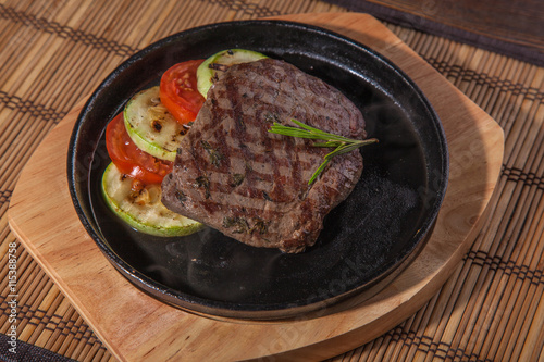 frying pan with a burning flambe