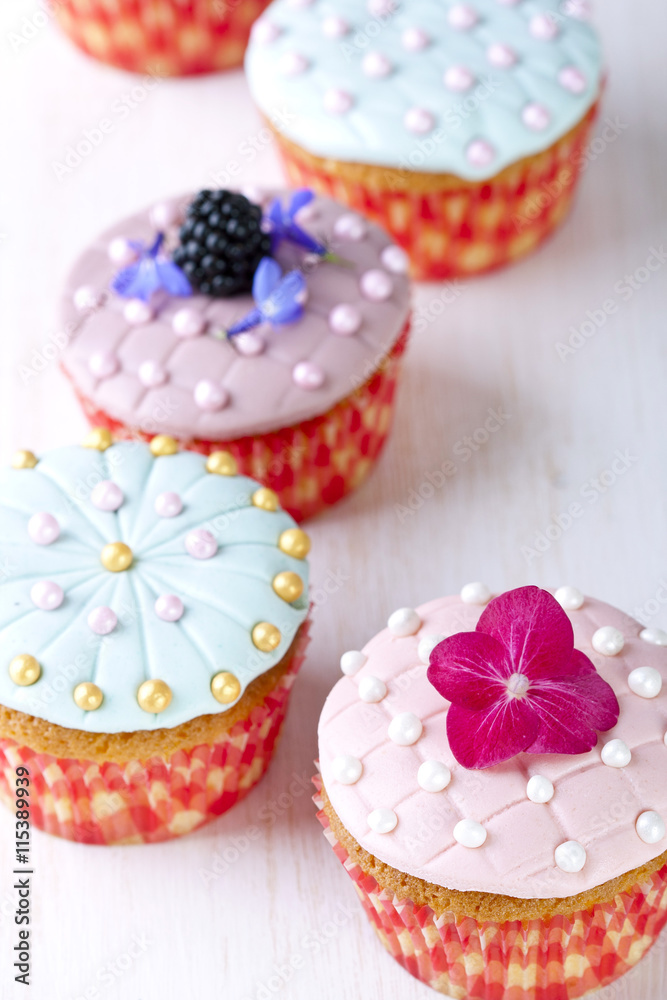 Cup-cake on a white wooden table Cup-cake on a white wooden table