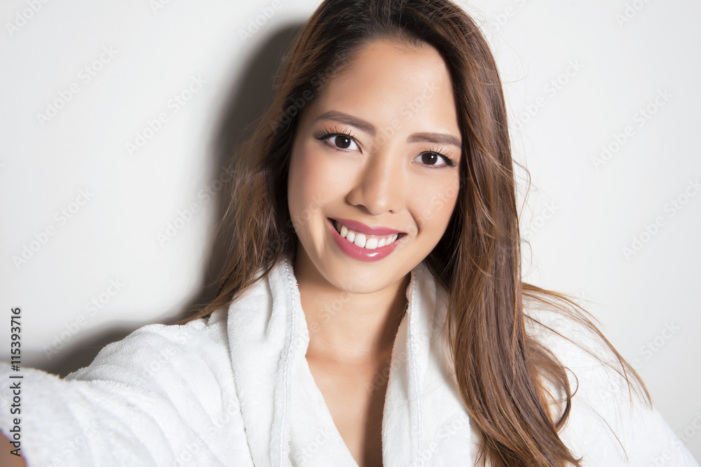 beautiful young asian woman with flawless skin and long hair posing in bath robe beautiful young asian woman with flawless skin and long hair posing in bath robe