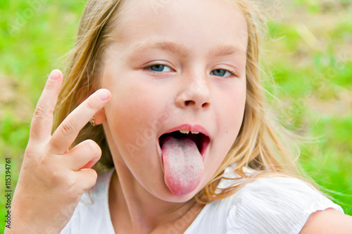 Cute girl with put out tongue