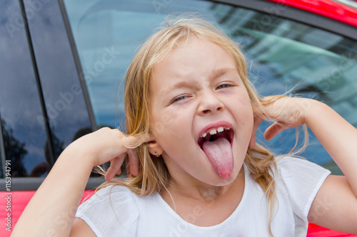 Cute girl with put out tongue