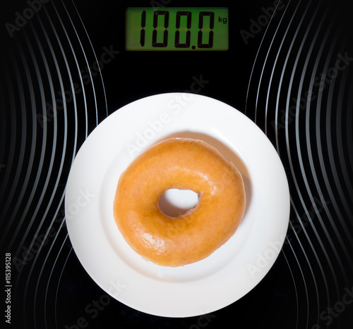 Donut make you fat to the weight of 100kg on digital dispaly photo