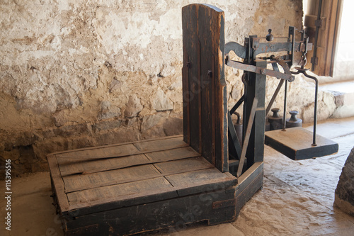 Old wooden platform scales in antique mill