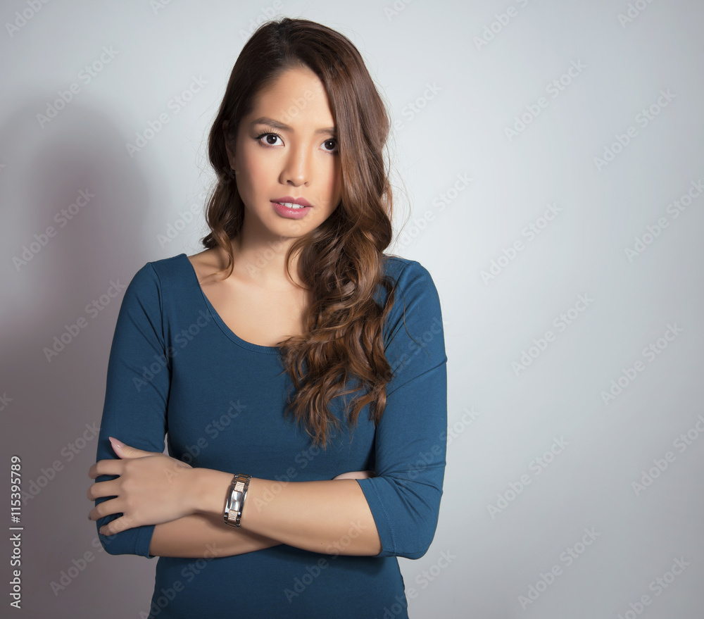 Fototapeta premium beautiful young asian woman with long hair posing with wrist watch