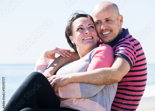 Couple embracing on the beach © JackF