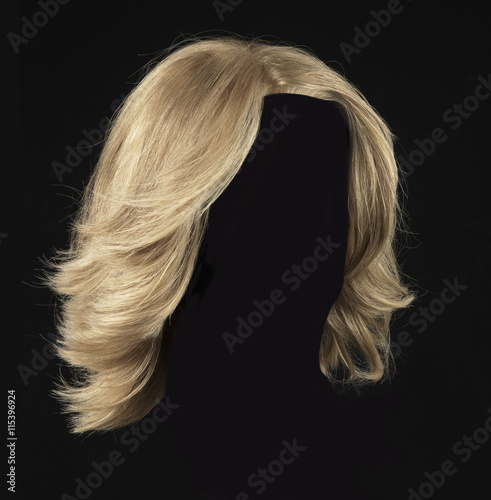 female blonde wig on a black background photo