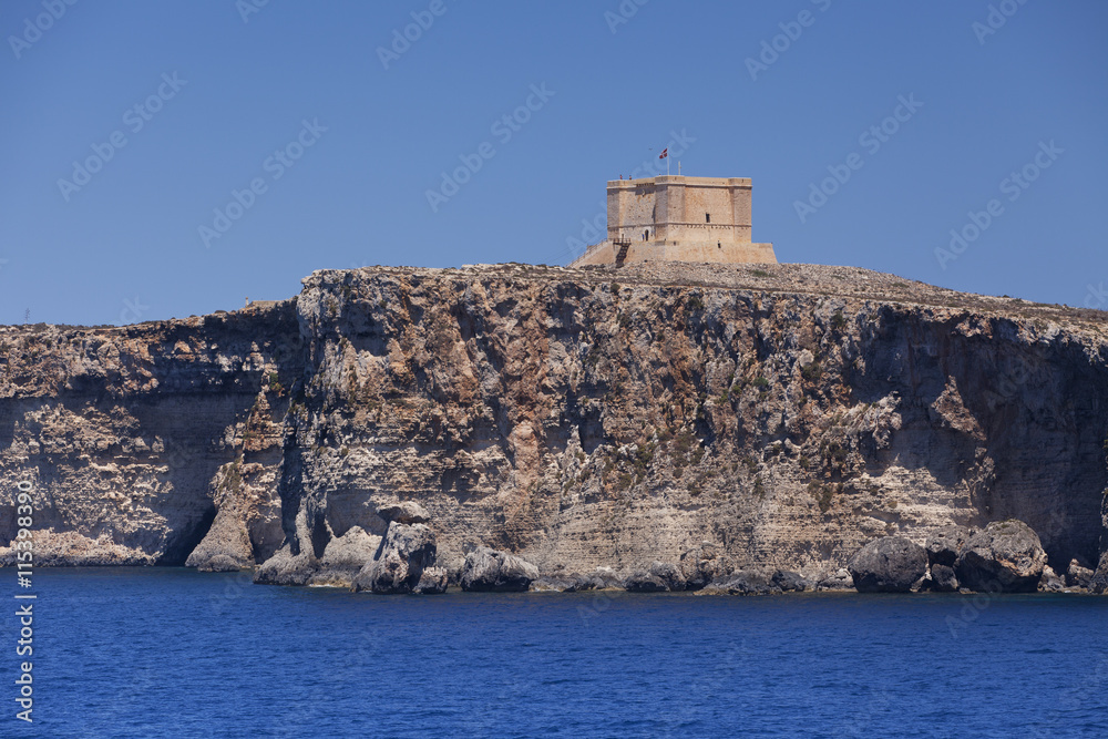 Saint Mary's Tower on the island of Comino, Malta on a sunny day 