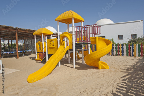 Wallpaper Mural Childrens climbing frame and slide in tropical resort playground Torontodigital.ca