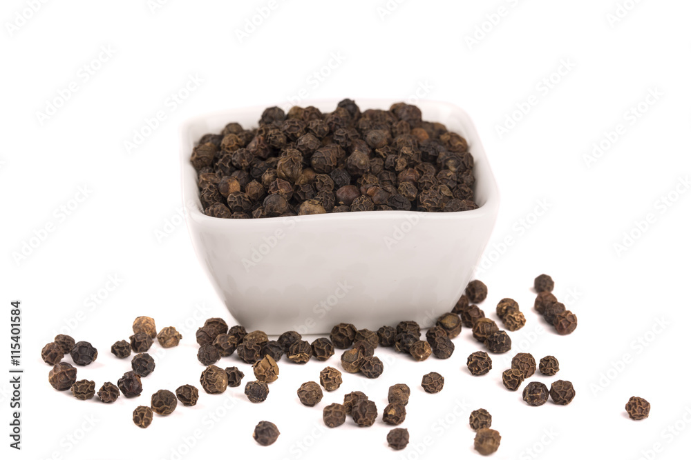Black pepper corns scattered on white background and Black pepper isolated on white background. Black pepper corns scattered on white background and Black pepper isolated on white background.
