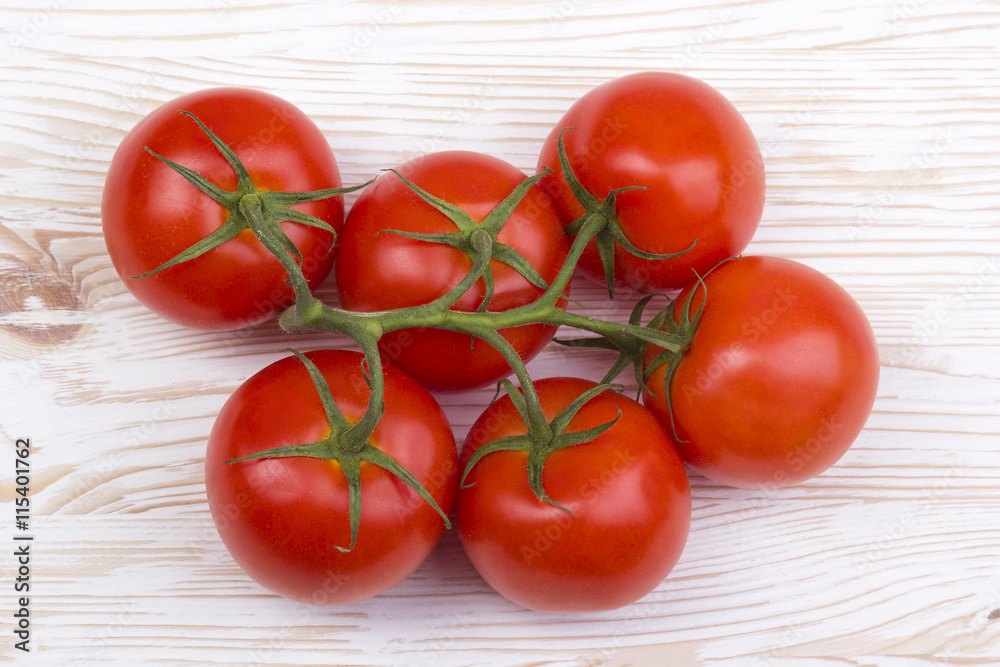 tomatoes on wooden background