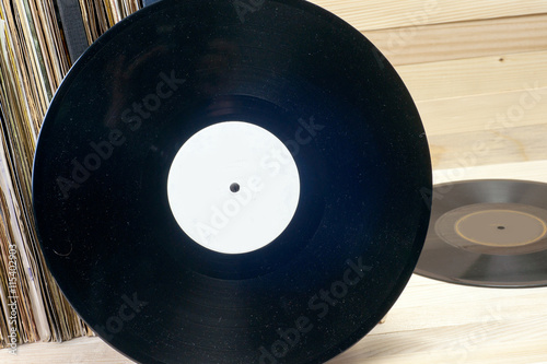 Vinyl record with copy space in front of a collection of albums dummy titles , vintage process