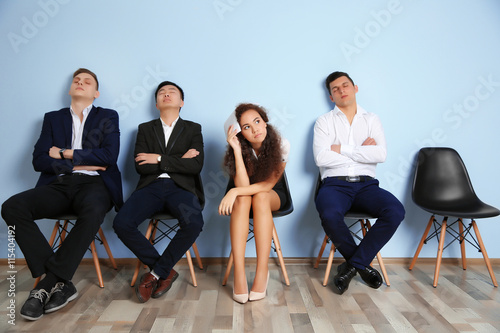 Group of people waiting for interview indoors