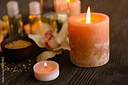 Lighted candles on blurred spa background