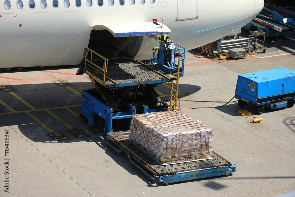 Fototapeta premium Loading cargo on a plane