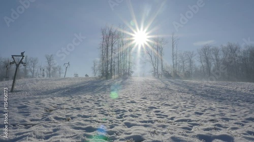 Modern ski complex and ropeway above town of Zajecar in Eastern Serbia 4K 3840X2160 UHD video - Winter time on the snowed ski slopes at early morning 4K 2160p UHD panning footage  photo