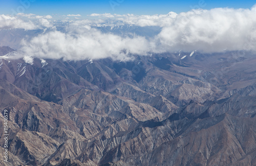 Himalaya mountains under clouds