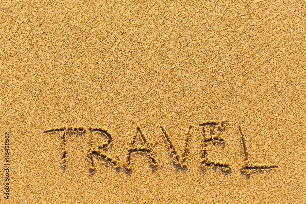 Fototapeta premium Travel - inscription on sand beach with the soft wave...