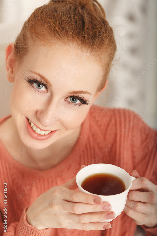 Ballerina drinking black tea and smiling Ballerina drinking black tea and smiling