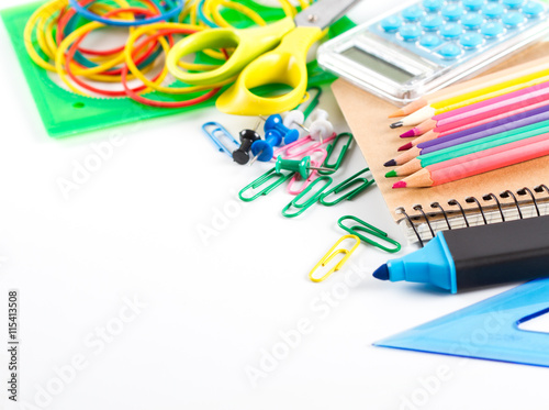 Assortment of school supplies on white background