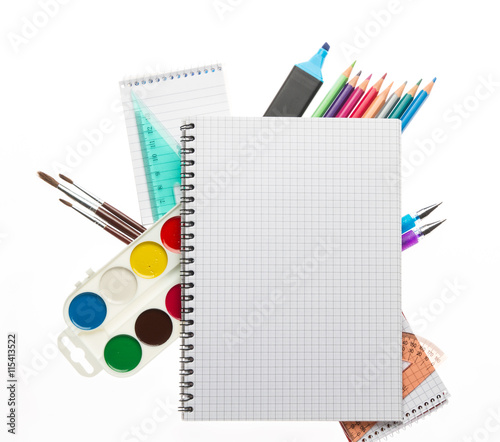 Assortment of school supplies on white background