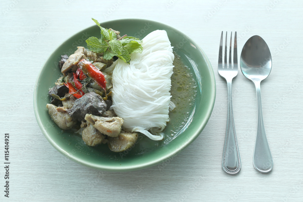 Curry chicken noodles (KHANOM CHIN) with vegetable.