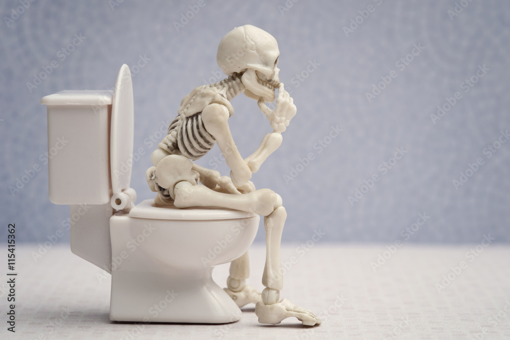 Skeleton thinking pose while sitting on water closet