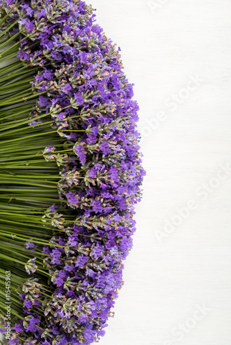 Fototapeta Naklejka Na Ścianę i Meble -  frame of lavender on a white wooden background