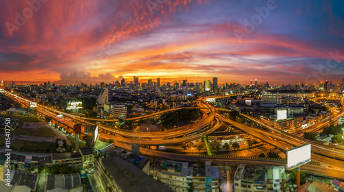 The traffic jam on expressways of Bangkok city with colorful sky twilight, tilt-shift 
