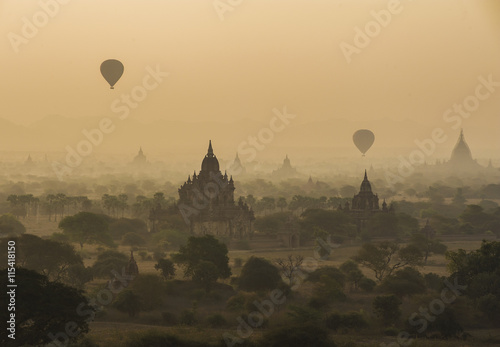 The pagoda forest ancient city of Bagan, scene panoramic with hot air flow balloons