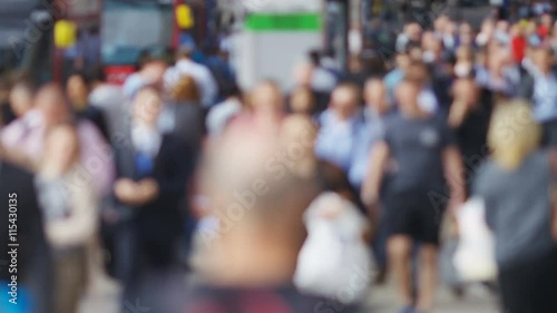 4K Anonymous crowd of people walking on a street in slow motion - version 3