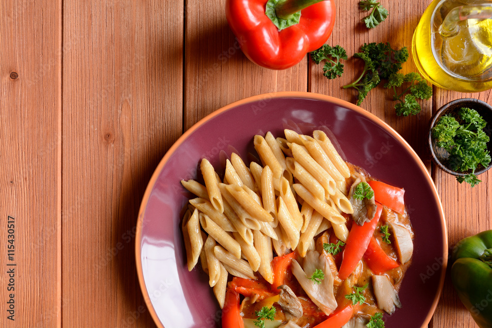 Stewed oyster mushrooms with peppers and whole wheat pasta