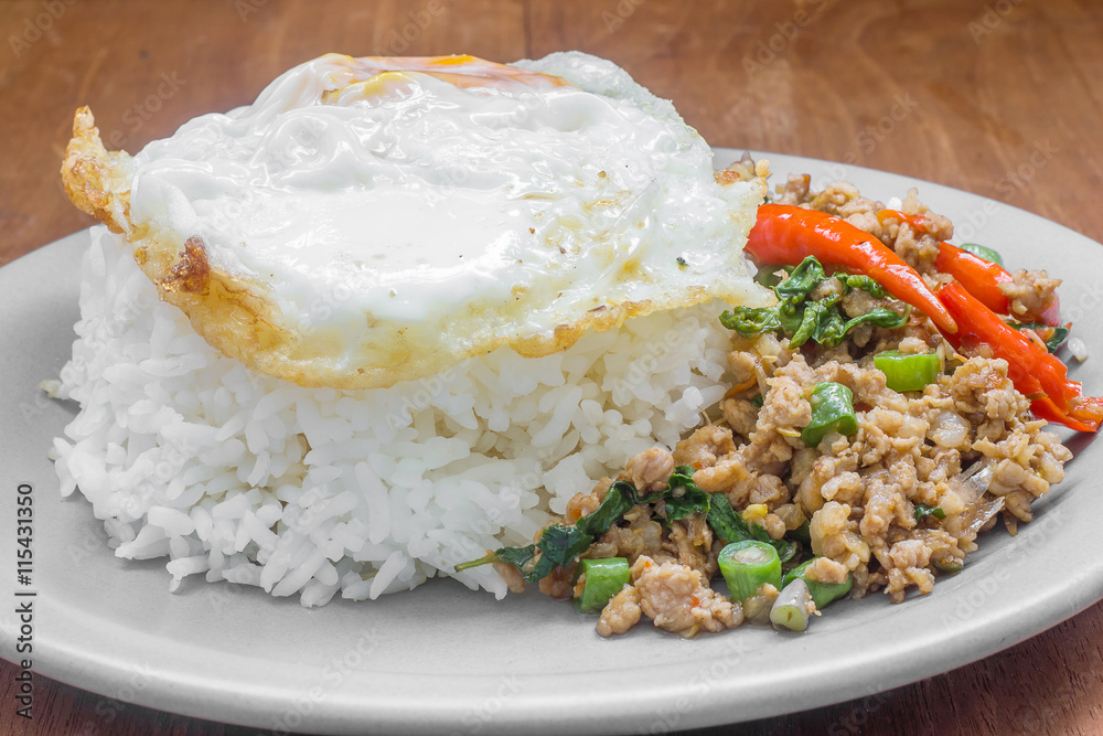 Rice topped with stir fried minced pork and basil. Thai food Rice topped with stir fried minced pork and basil. Thai food