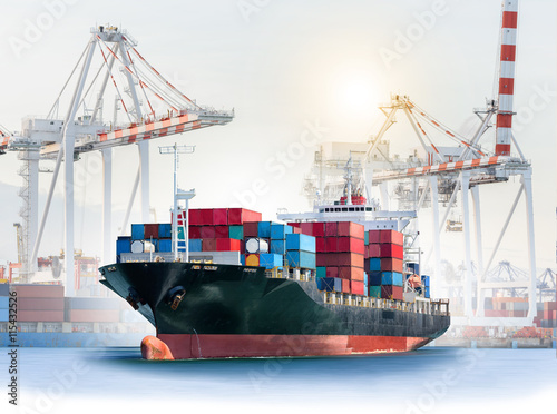 Logistics and transportation of International Container Cargo ship with ports crane bridge in harbor for logistic import export background and transport industry.
