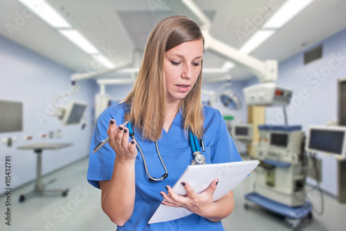 Shocked woman doctor reading her clipboard