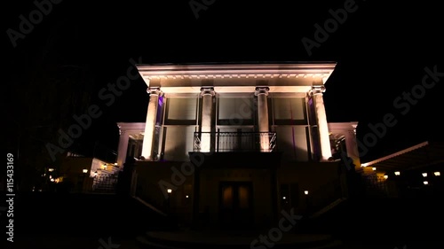 Big house with column lighting at the night.